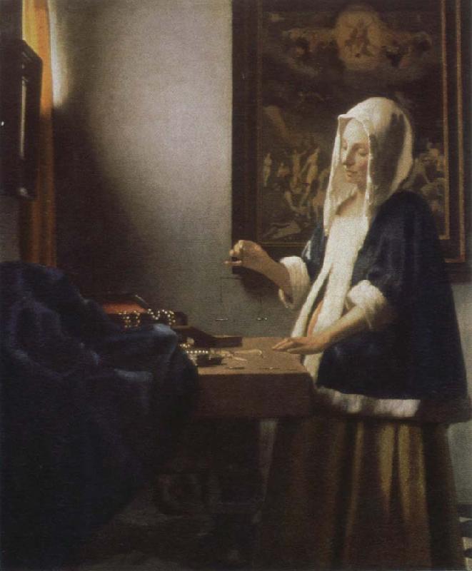 Jan Vermeer woman holding a balance oil painting image